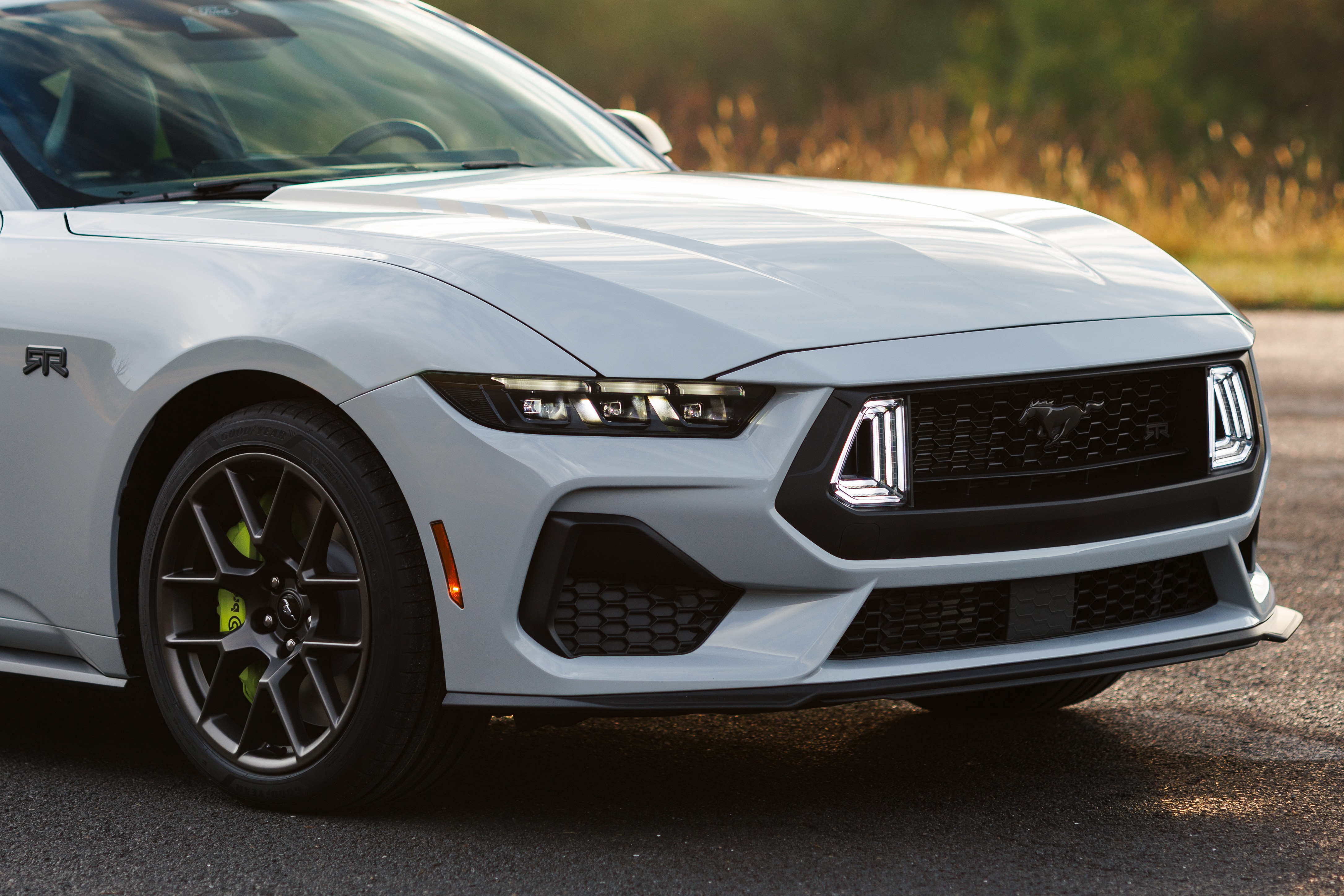 Optional RTR package available on 2026 Ford Mustang EcoBoost fastback. Preproduction model shown with optional Hyper Lime brake caliper shown. Available late spring 2026.